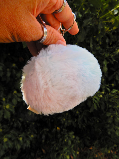 A rainbow plush keychain/ bag charm.