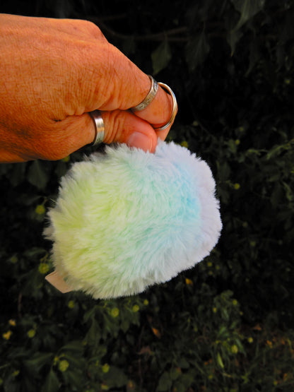 A rainbow plush keychain/ bag charm.